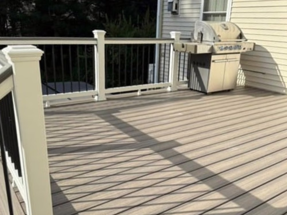 Freshly remodeled composite deck with white railings – Deck Remodeling Franklin MA