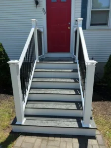 New stairs Milford MA front view of finished gray steps and white posts