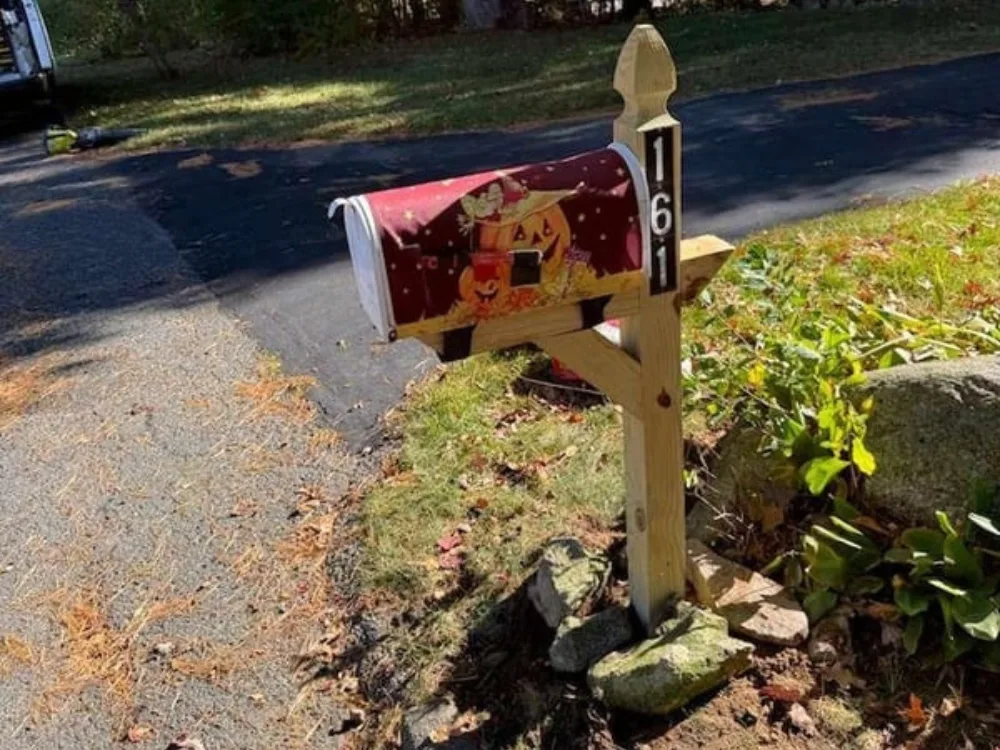 mailbox post replacement completed at address 161 with new wood post and seasonal mailbox cover.