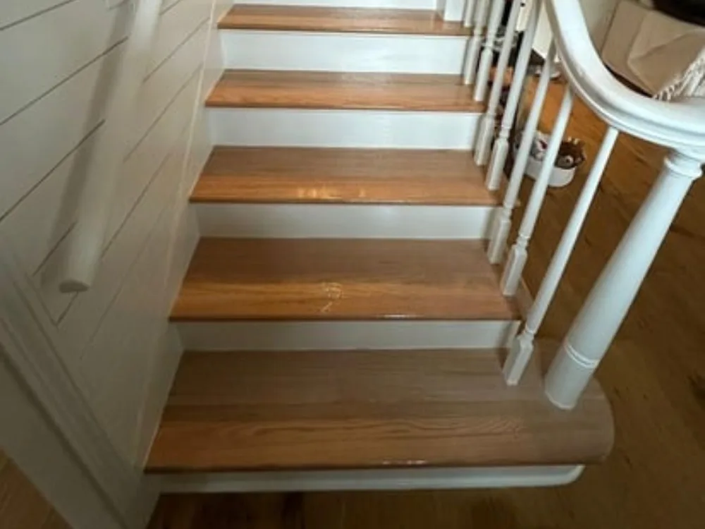 stairs remodeling in Holliston MA showing wood steps and white risers