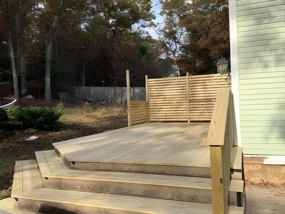 Deck reconstruction project with newly built platform and steps.