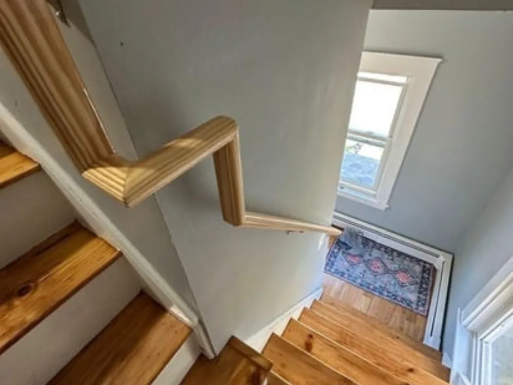 Railings Installation Milford MA with angled interior handrail transition