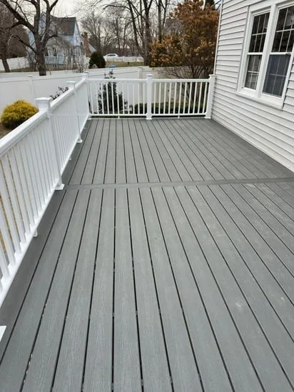 Finished gray composite surface from a deck remodeling Walpole MA.